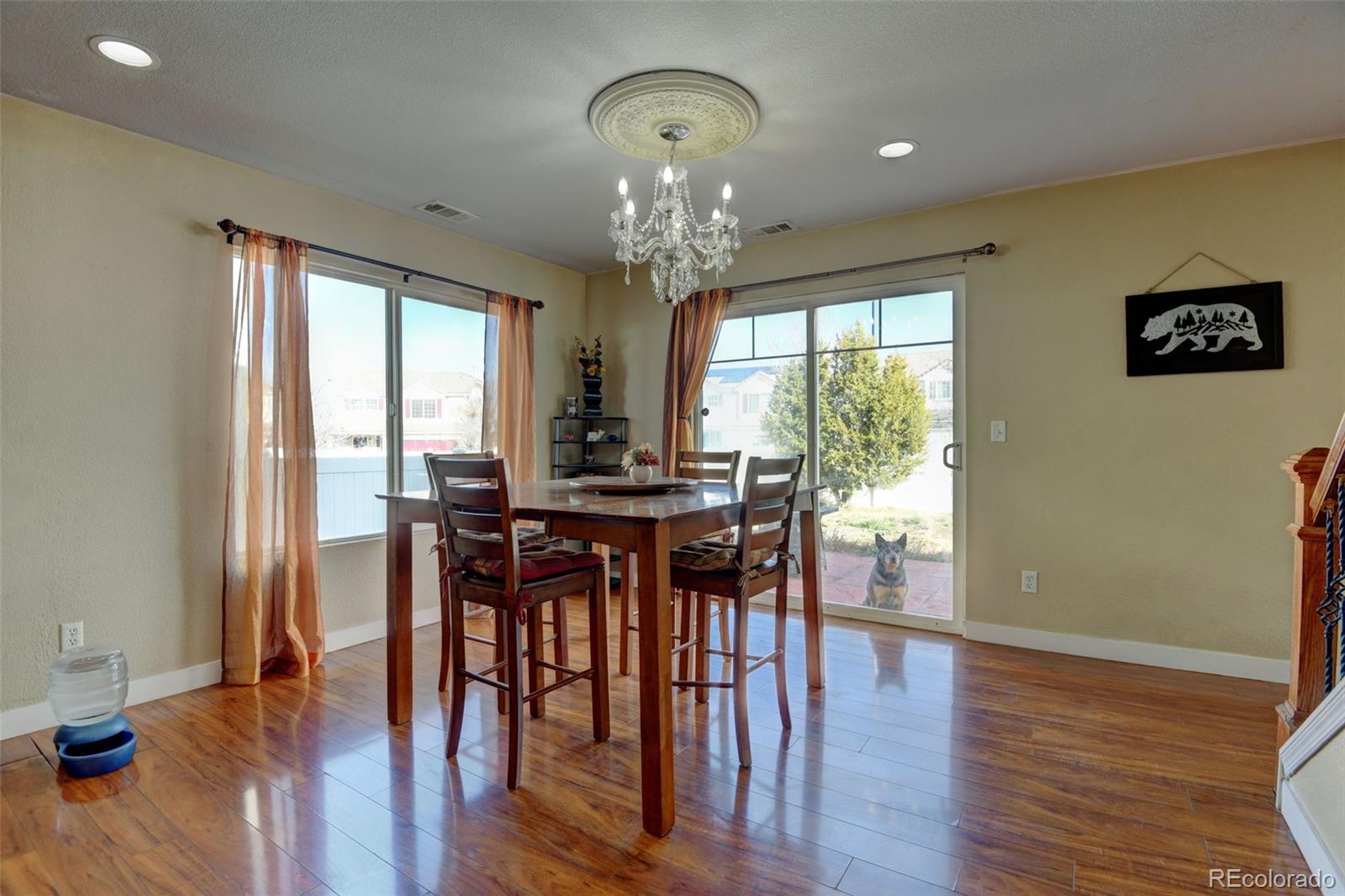 5555 Perth Court Denver, CO 80249 - Photo 8 of 31 a view of a dining room with furniture window and wooden floor