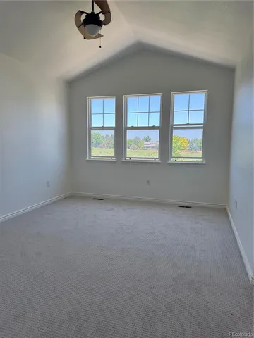 a bath tub sitting in a bathroom next to a window