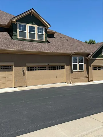 a front view of a house with yard