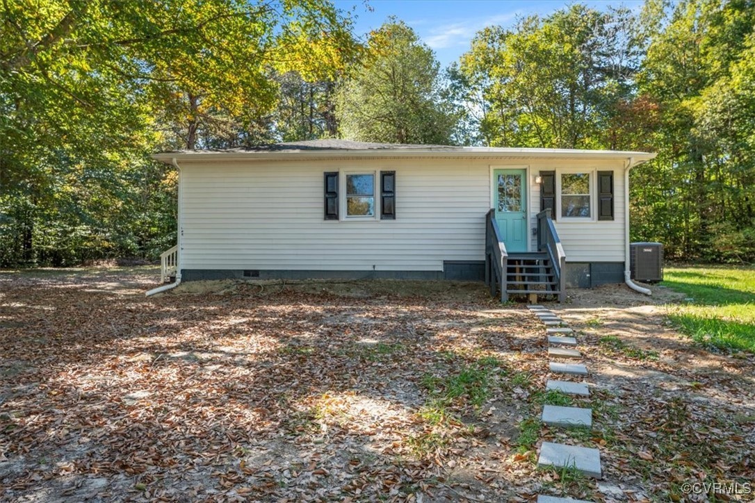 View of front of house with central AC unit