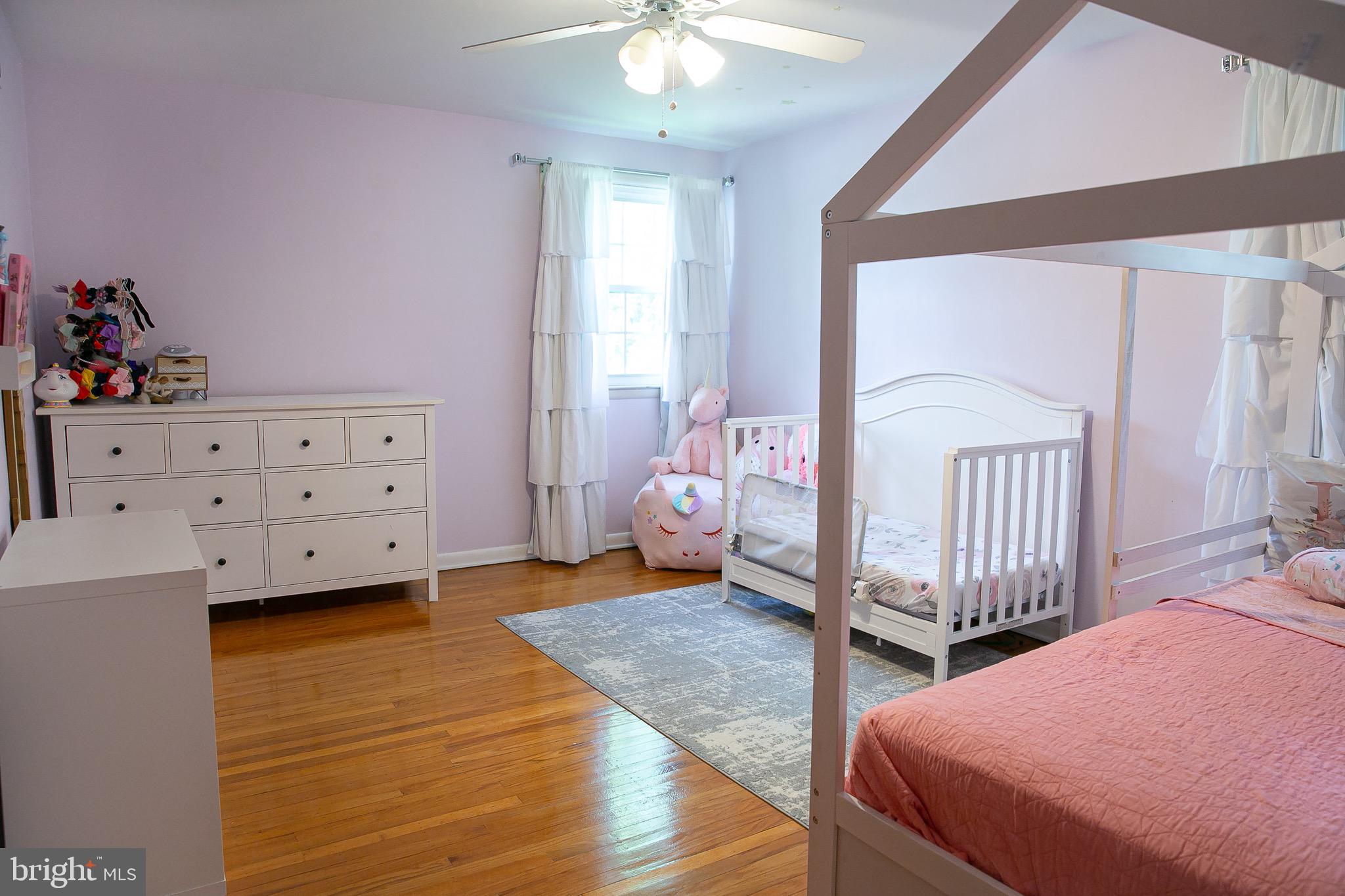 1395 Varnum Drive Wayne, PA 19087 - Photo 17 of 21 a bedroom with a bed and a chandelier