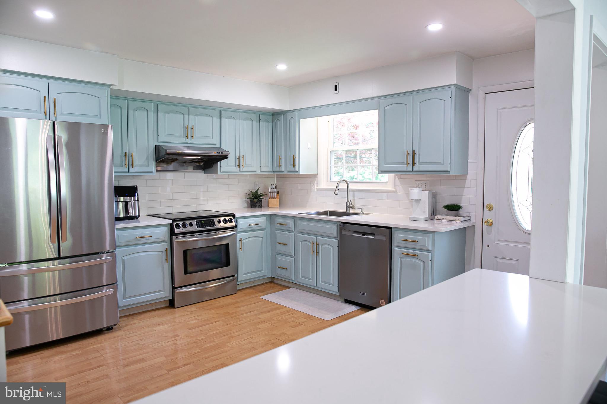 1395 Varnum Drive Wayne, PA 19087 - Photo 10 of 21 a kitchen with a sink stove and refrigerator