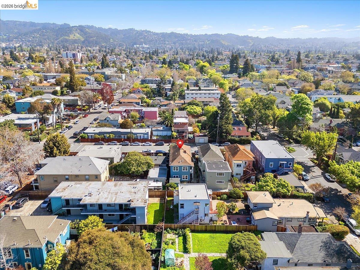 3110 California Street Berkeley, CA 94703 - Photo 26 of 41 Aerial view of residential area featuring a mountain backdrop
