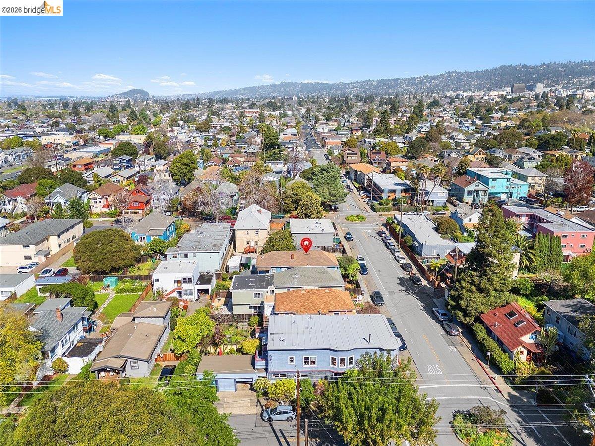 3110 California Street Berkeley, CA 94703 - Photo 28 of 41 Aerial perspective of suburban area with a mountain backdrop