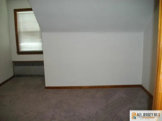 an empty room with a bench