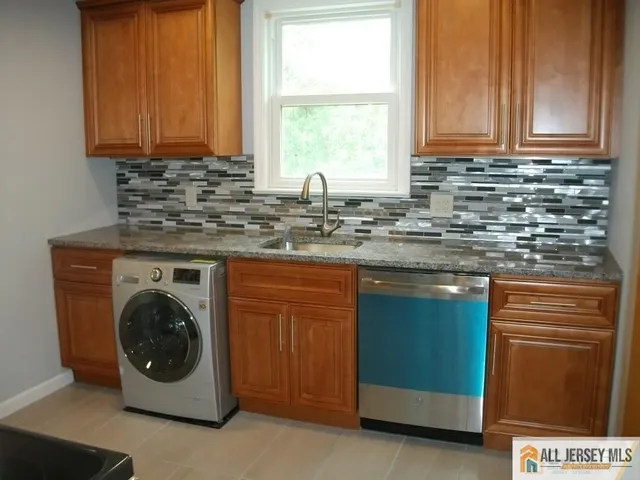a kitchen with a window and a sink