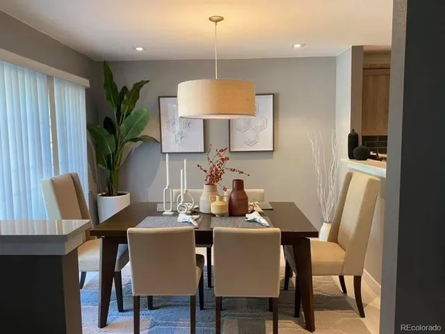 a dining room with furniture and wooden floor