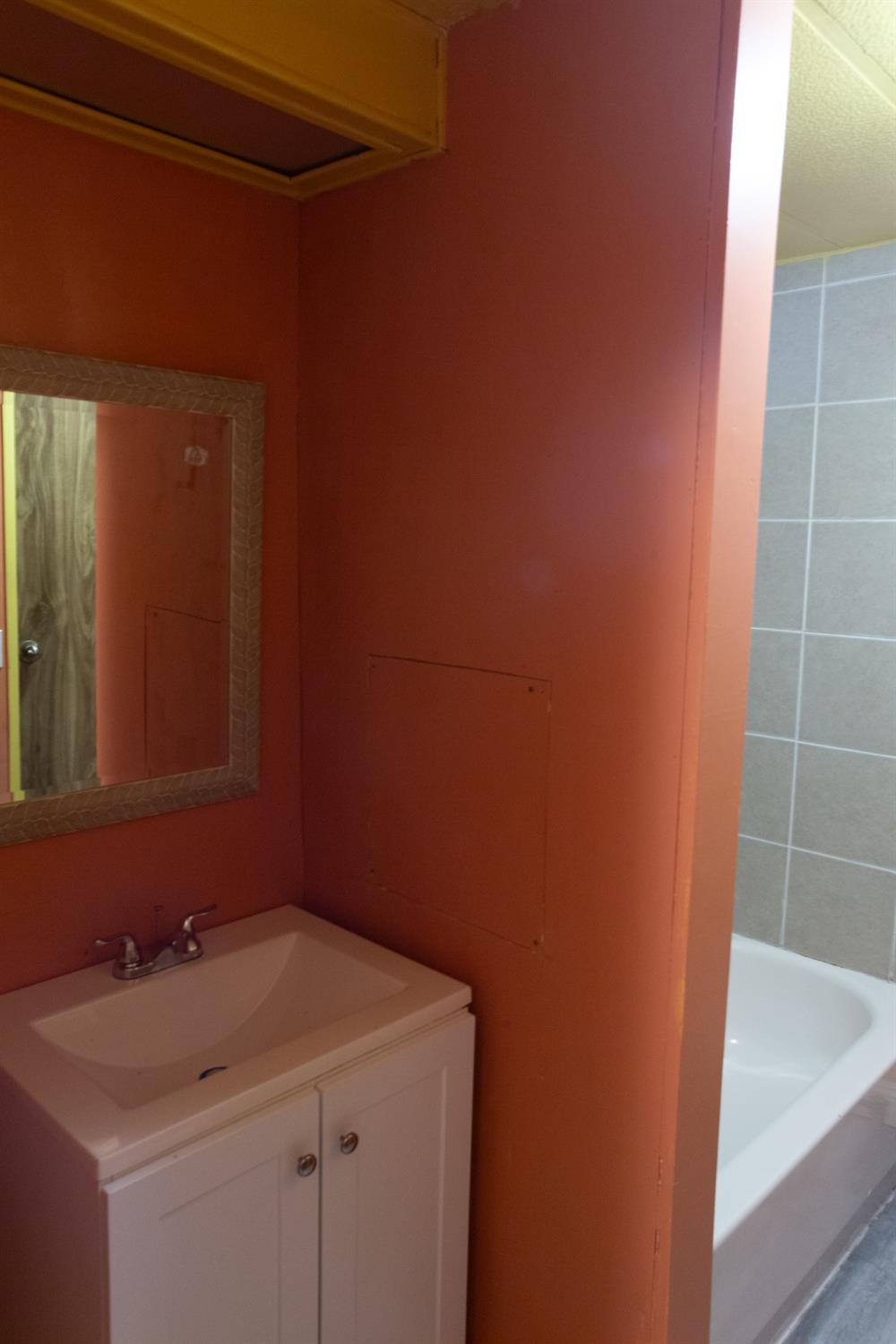 350 Pleasant Valley Road, Unit 8 Diamond Springs, CA 95619 - Photo 13 of 26 a bathroom with a sink and a mirror