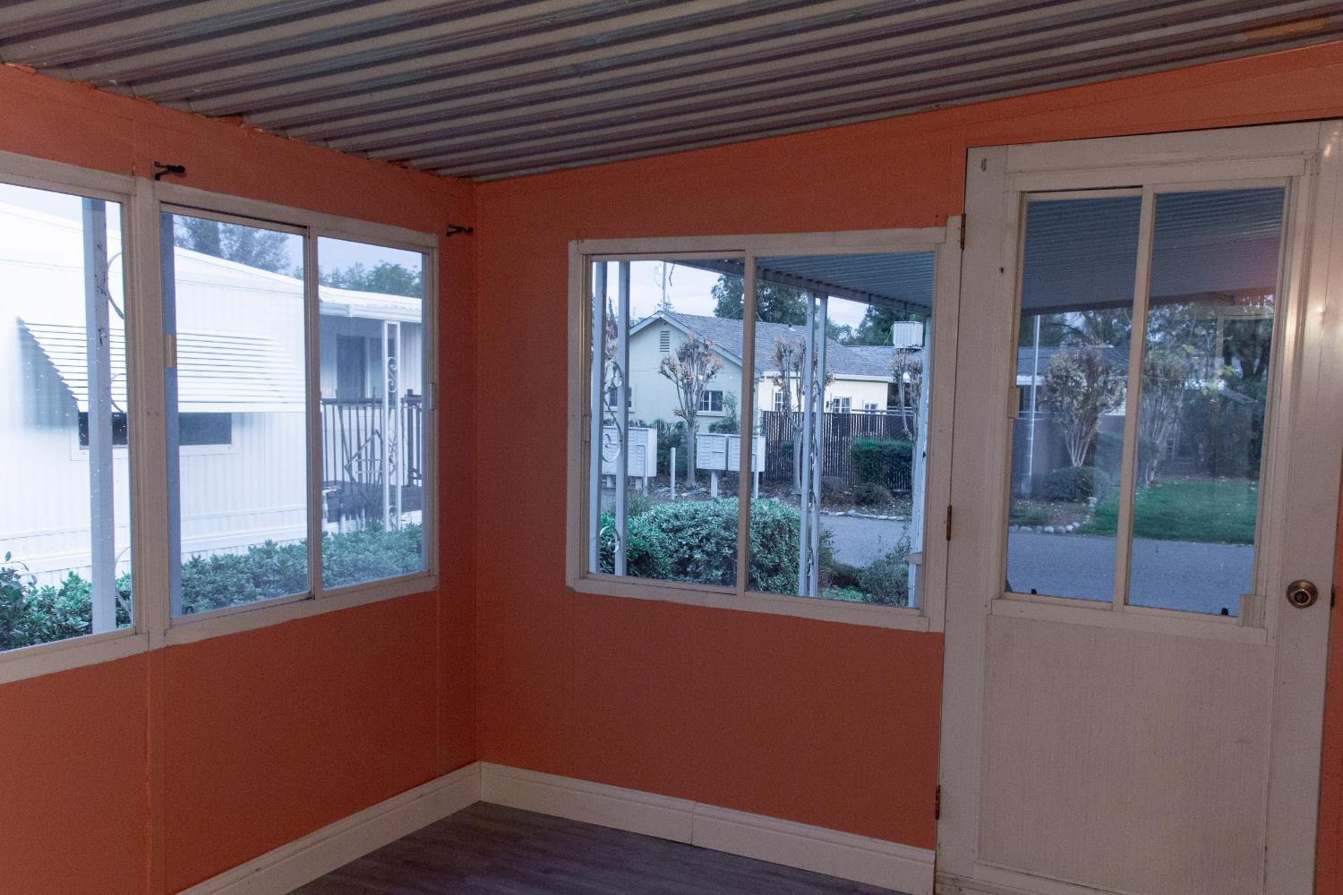 350 Pleasant Valley Road, Unit 8 Diamond Springs, CA 95619 - Photo 21 of 26 a view of a room that has wooden floor and a large window