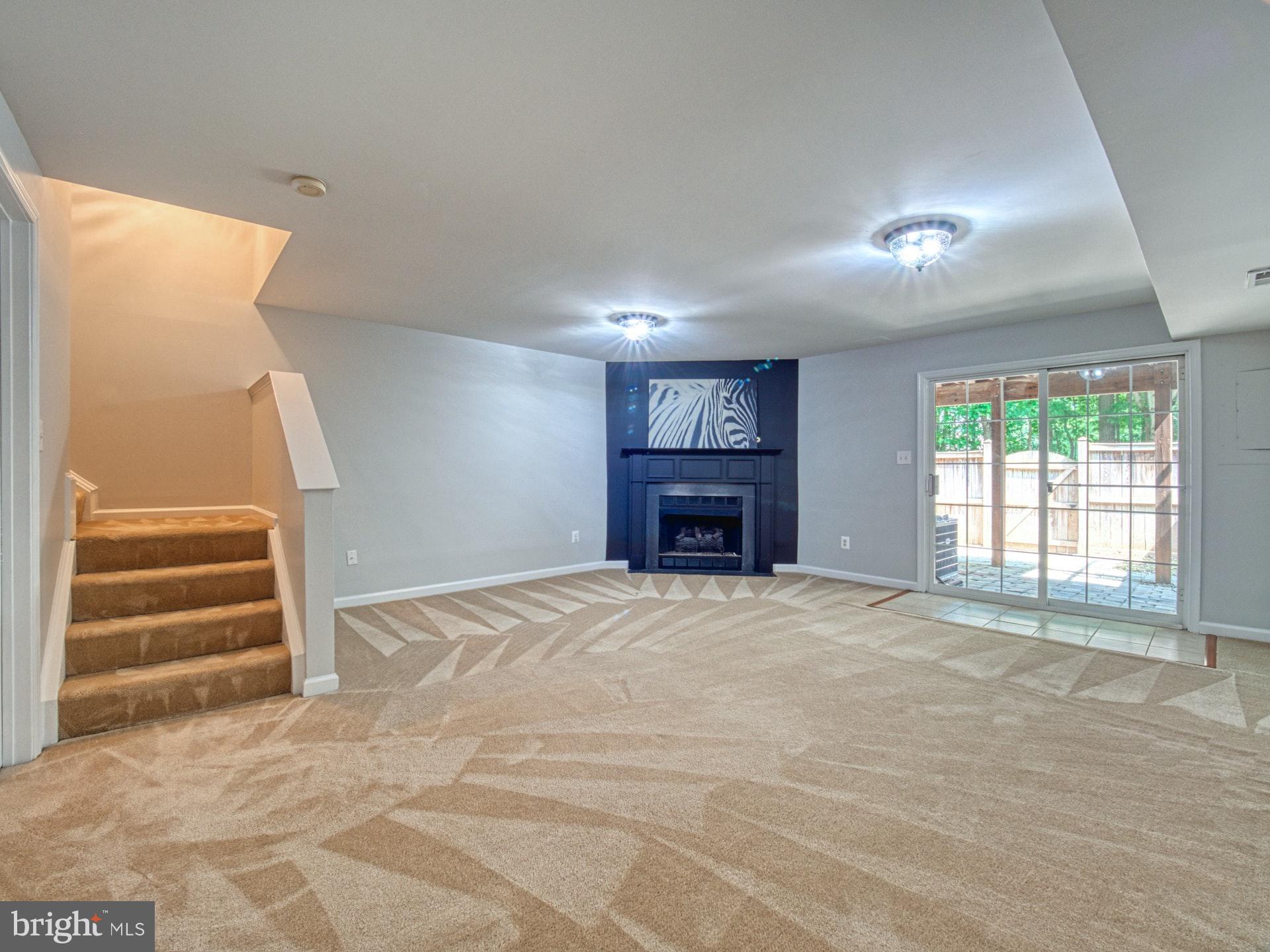 11451 Heritage Commons Way Reston, VA 20194 - Photo 16 of 23 FINISHED LOWER LEVEL WALKS OUT TO BACKYARD