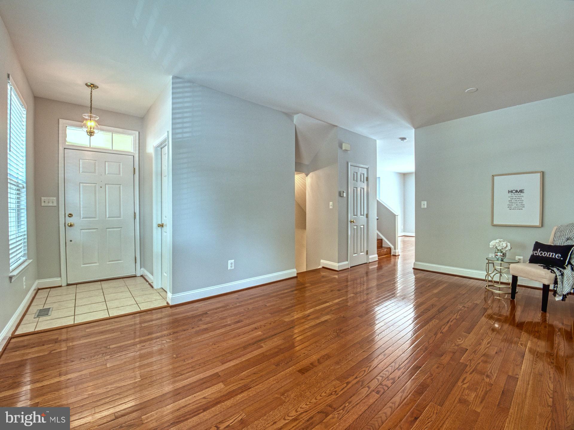 11451 Heritage Commons Way Reston, VA 20194 - Photo 4 of 23 GLEAMING HARDWOODS ON MAIN LEVEL
