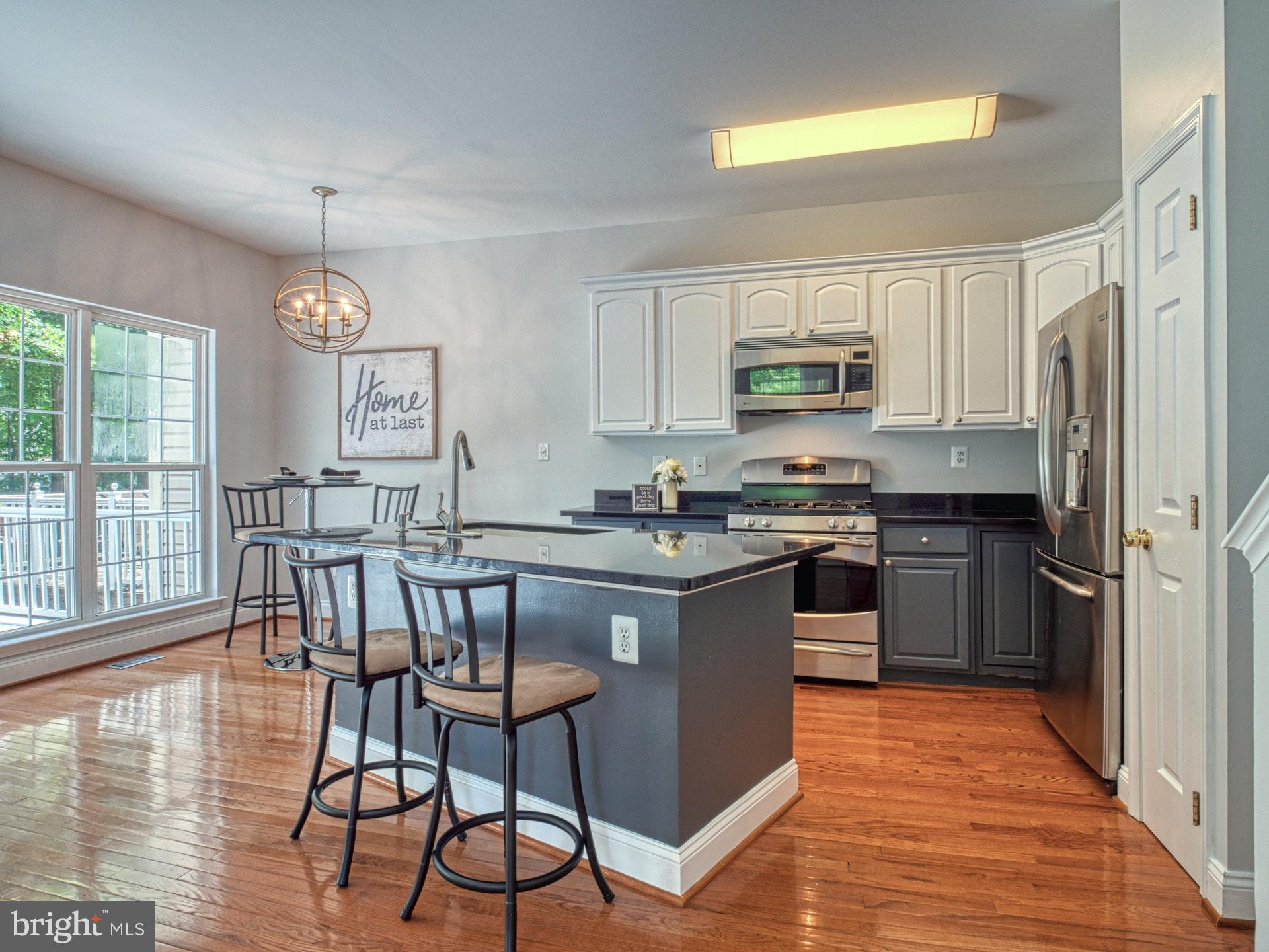 11451 Heritage Commons Way Reston, VA 20194 - Photo 6 of 23 HIP CABINETS + GRANITE + STAINLESS STEEL