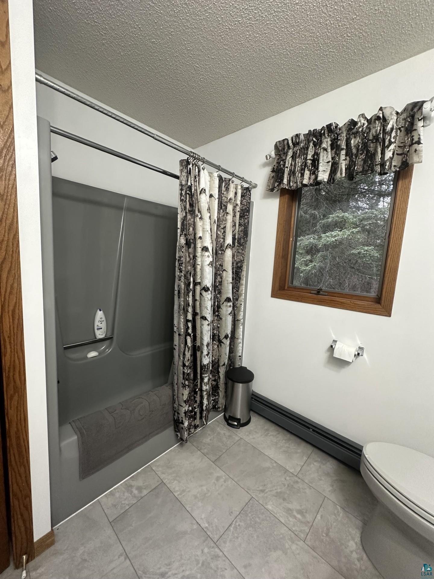 81 Hautaluoma Road Esko, MN 55733 - Photo 34 of 43 Full bathroom featuring a grey fiberglass shower and bath combination