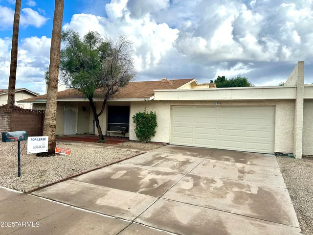 a view of a house with a garage
