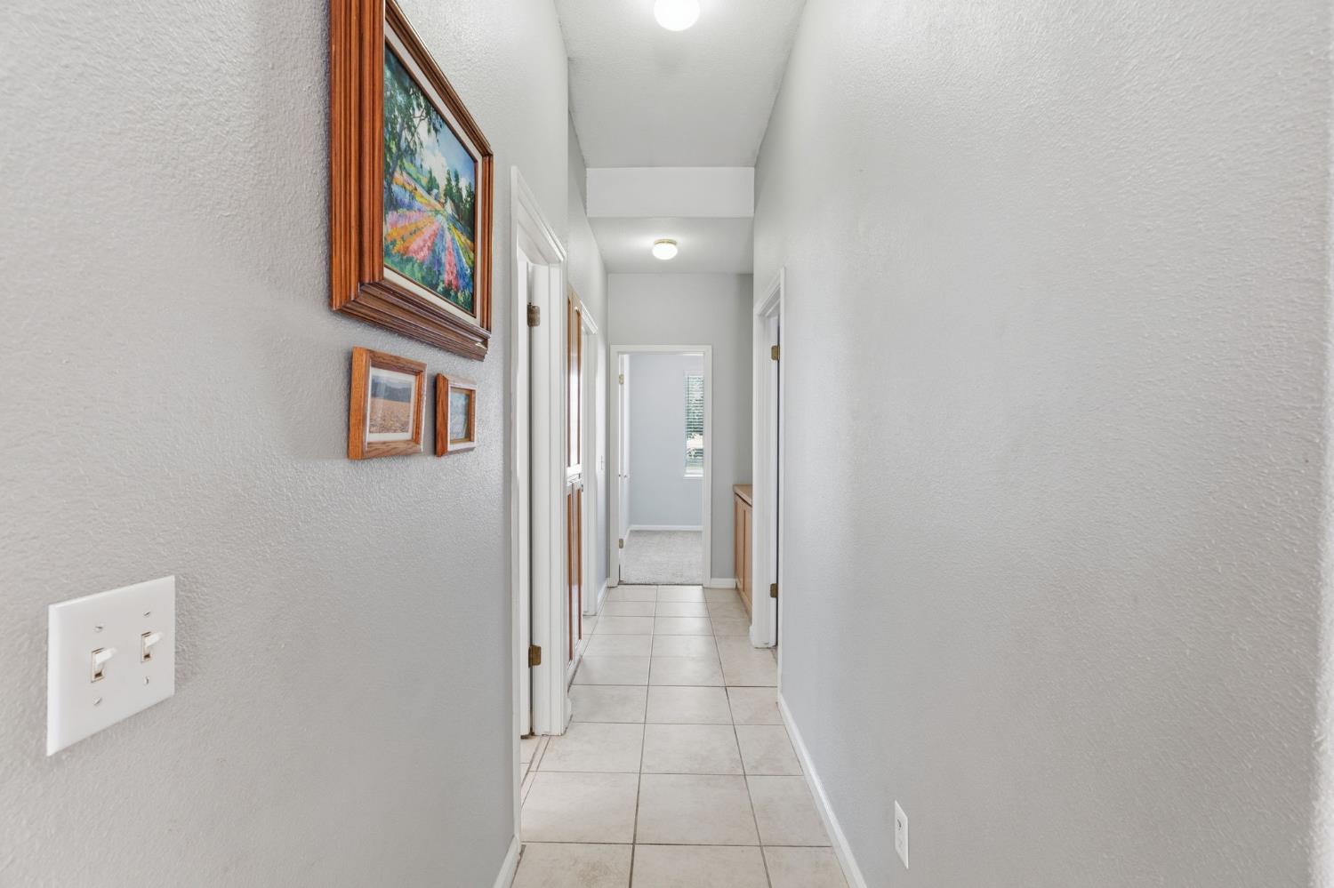 1757 Homestead Way Lemoore, CA 93245 - Photo 17 of 35 a view of a hallway