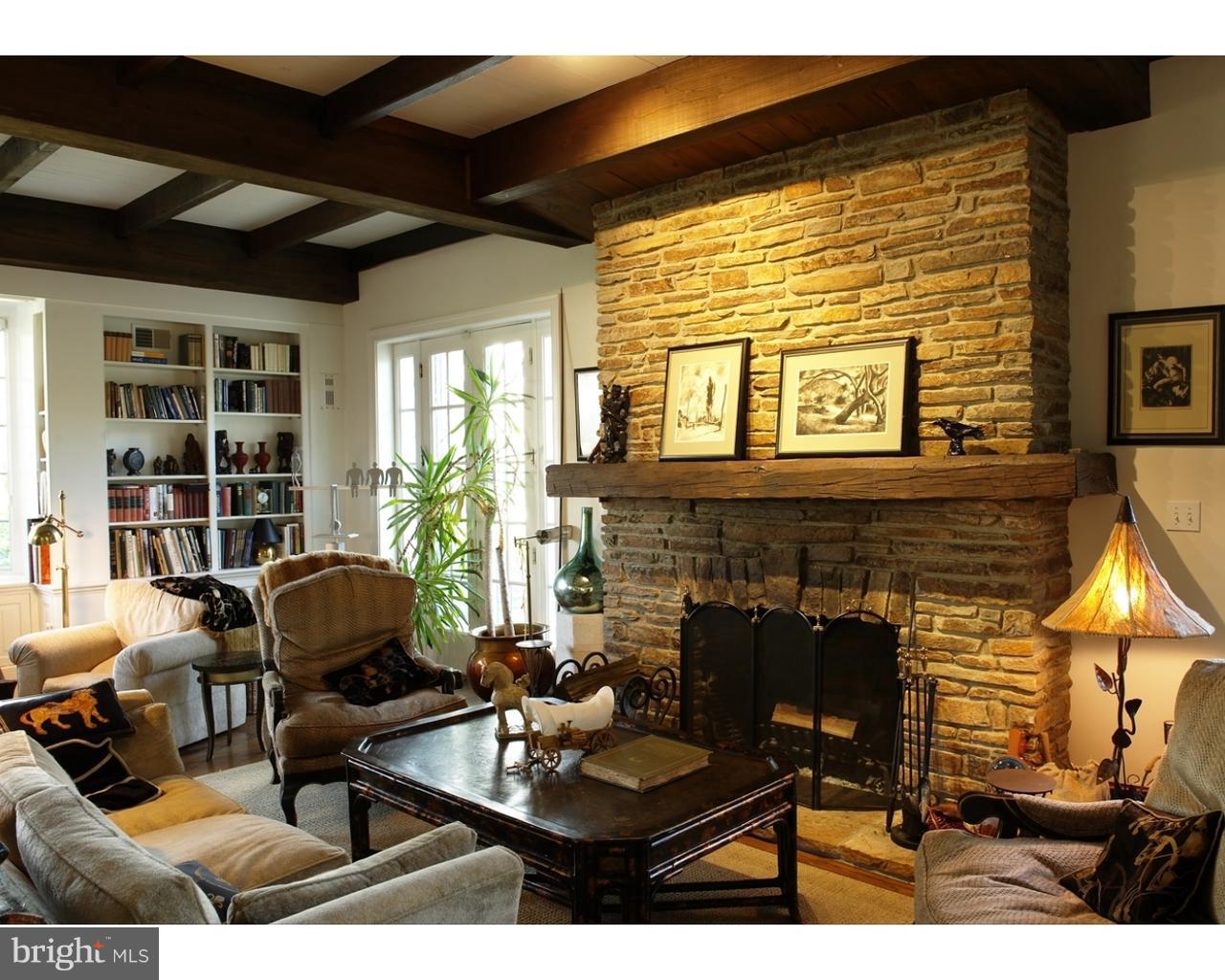 457 East London Grove Road West Grove, PA 19390 - Photo 4 of 22 a living room with furniture a fireplace and a large window