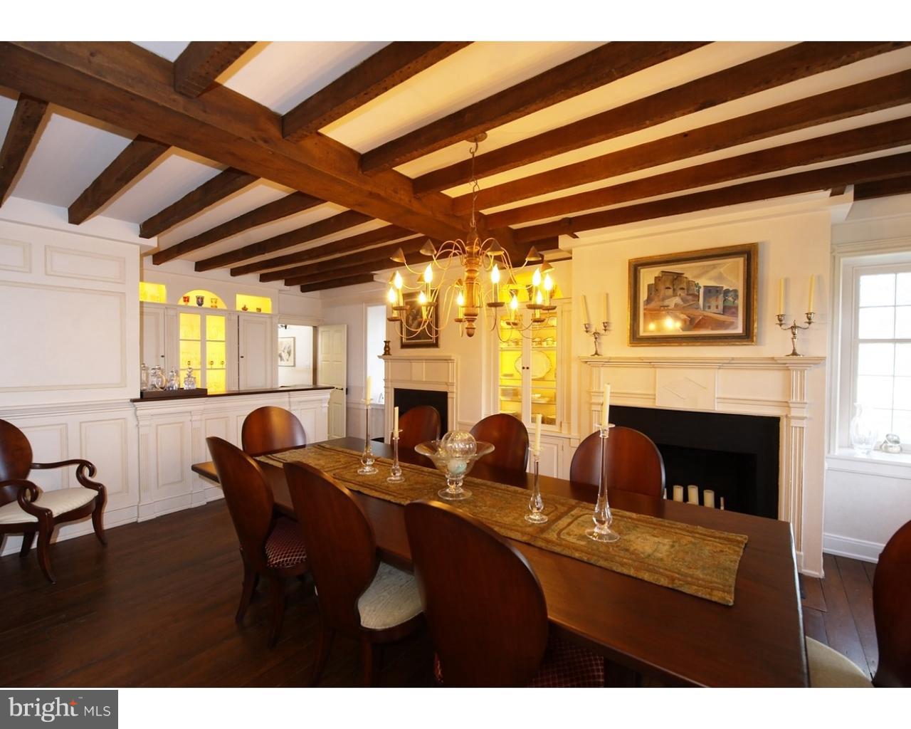 457 East London Grove Road West Grove, PA 19390 - Photo 5 of 22 a view of a dining room with furniture and a fireplace