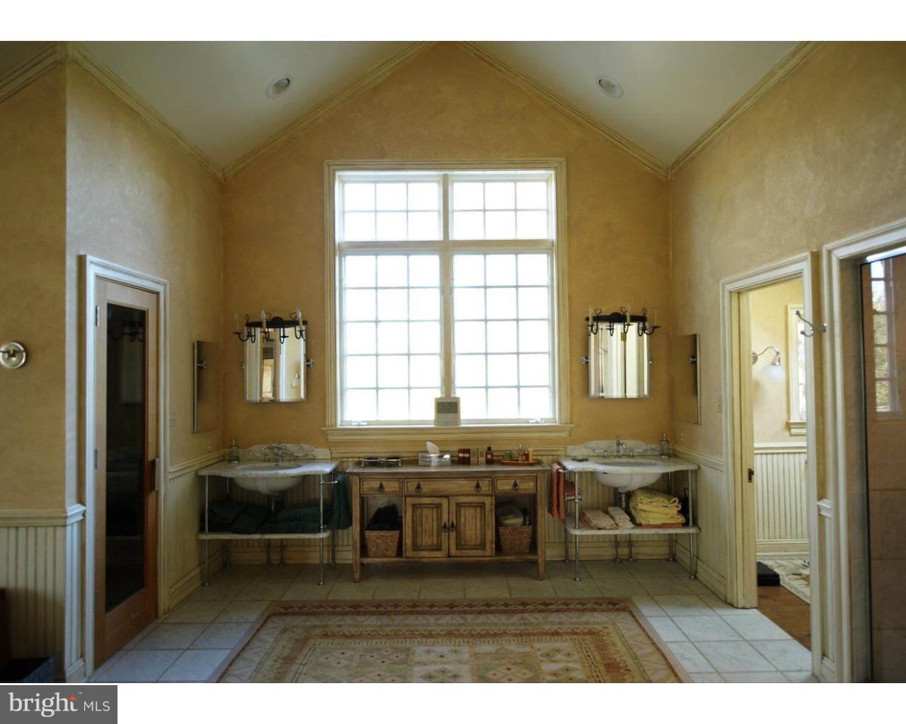 457 East London Grove Road West Grove, PA 19390 - Photo 10 of 22 a living room with a kitchen counter space and a window