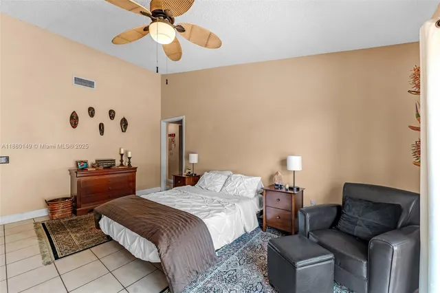 a bedroom with furniture and a chandelier