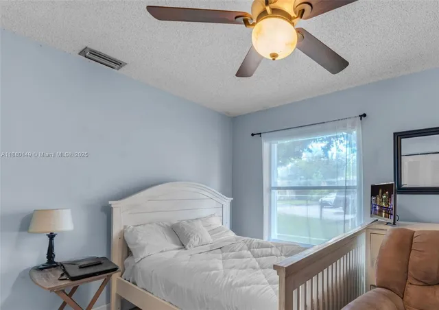 a living room with furniture chandelier and a window