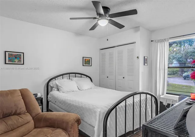 a view of a livingroom with furniture and a window