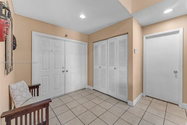 a view of a hallway with closet area