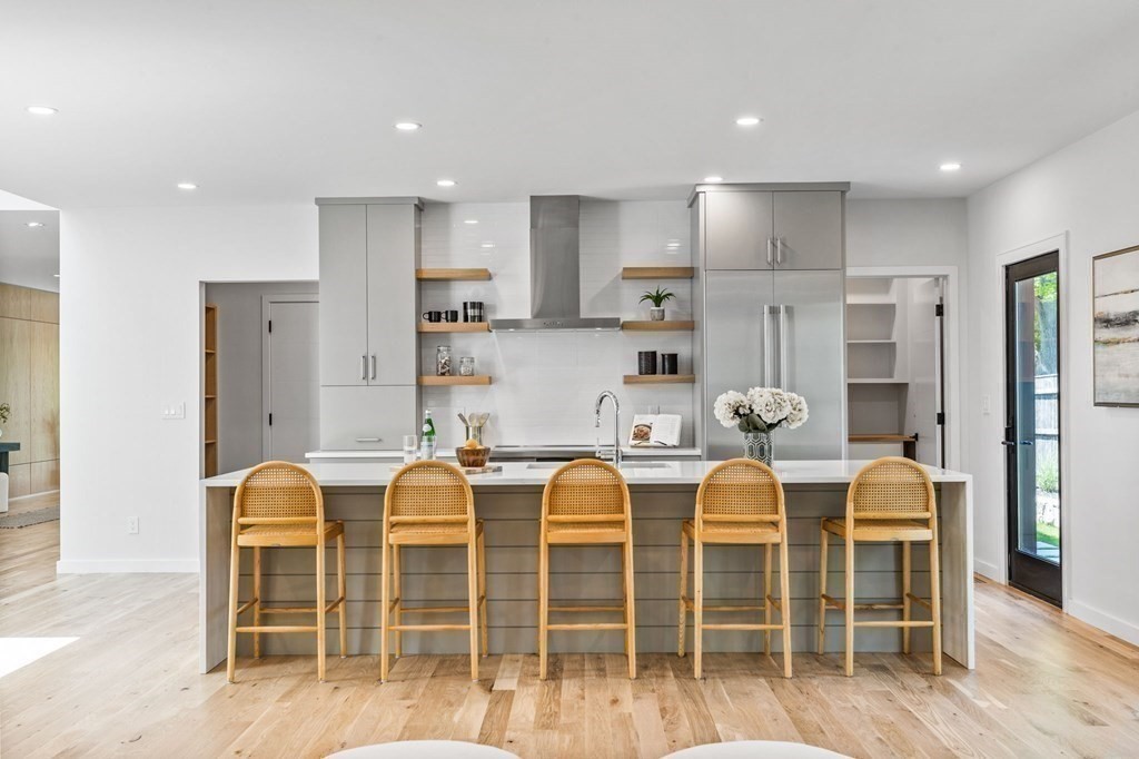 16 Eldridge Court Hingham, MA 02043 - Photo 14 of 41 a large kitchen with a table and chairs