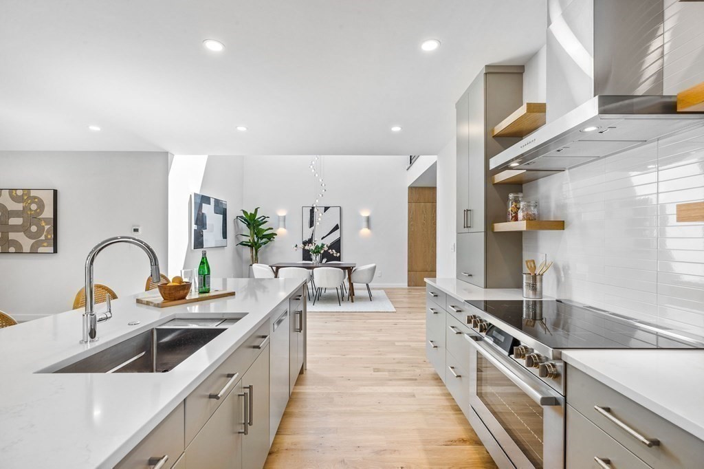 16 Eldridge Court Hingham, MA 02043 - Photo 15 of 41 a kitchen with stainless steel appliances granite countertop a sink and a stove