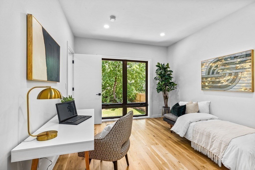 16 Eldridge Court Hingham, MA 02043 - Photo 17 of 41 a bedroom that has a bed and a table in it