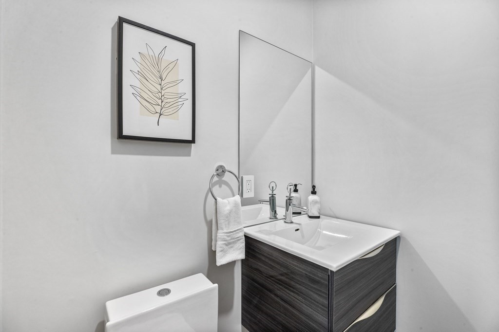 16 Eldridge Court Hingham, MA 02043 - Photo 20 of 41 a bathroom with a sink vanity and a mirror