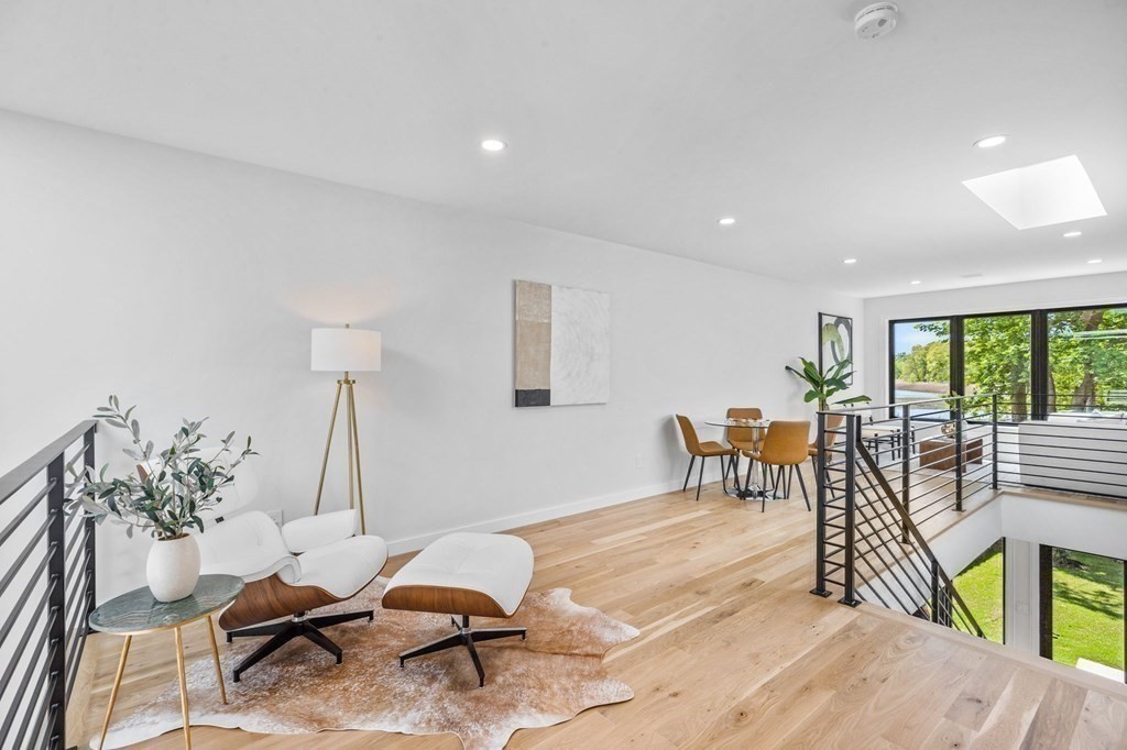 16 Eldridge Court Hingham, MA 02043 - Photo 21 of 41 a living room with furniture a window and a table