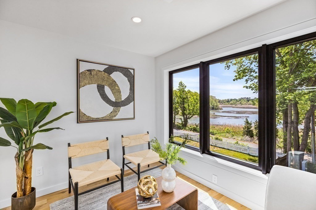 16 Eldridge Court Hingham, MA 02043 - Photo 22 of 41 a living room with furniture and a large window