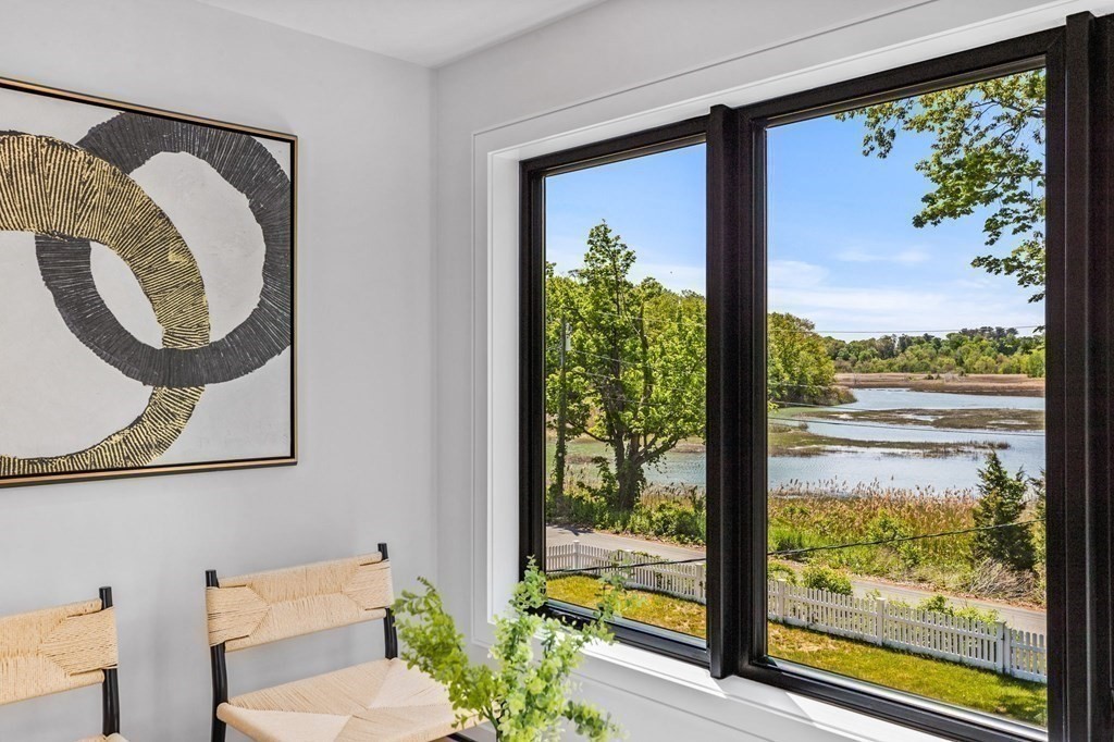16 Eldridge Court Hingham, MA 02043 - Photo 23 of 41 a view of a balcony with chair and a potted plant