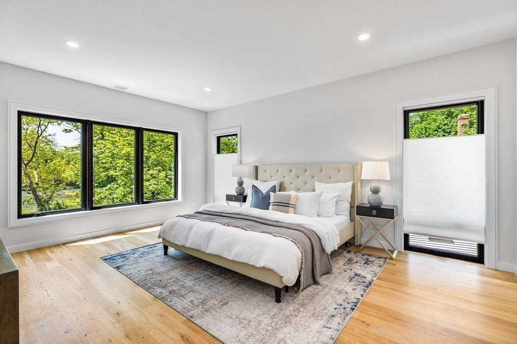 16 Eldridge Court Hingham, MA 02043 - Photo 26 of 41 a spacious bedroom with a bed and a large window