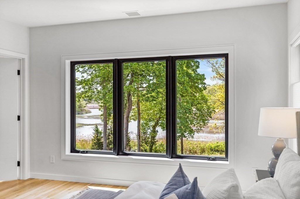 16 Eldridge Court Hingham, MA 02043 - Photo 28 of 41 a view of a bedroom with furniture and a large window