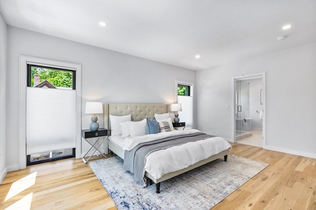 16 Eldridge Court Hingham, MA 02043 - Photo 29 of 41 a bedroom with a bed and a potted plant