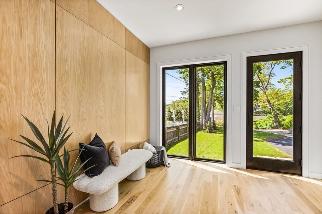16 Eldridge Court Hingham, MA 02043 - Photo 3 of 41 a living room with furniture and a gate
