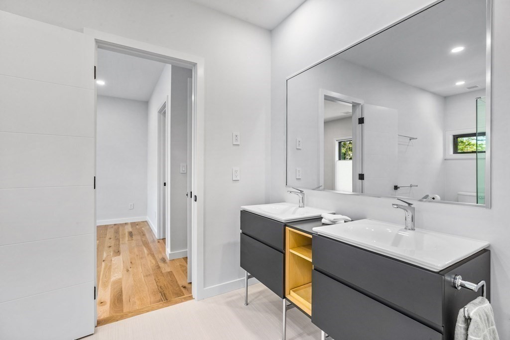 16 Eldridge Court Hingham, MA 02043 - Photo 33 of 41 a bathroom with a sink double vanity and a mirror