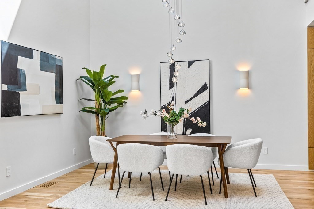 16 Eldridge Court Hingham, MA 02043 - Photo 7 of 41 a dining room with furniture and a potted plants