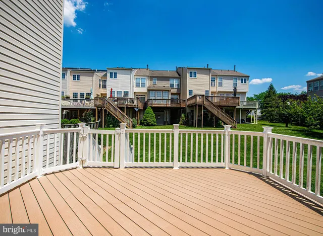 a view of a balcony with wooden floor