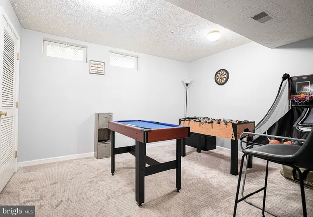 a room with furniture and a rug