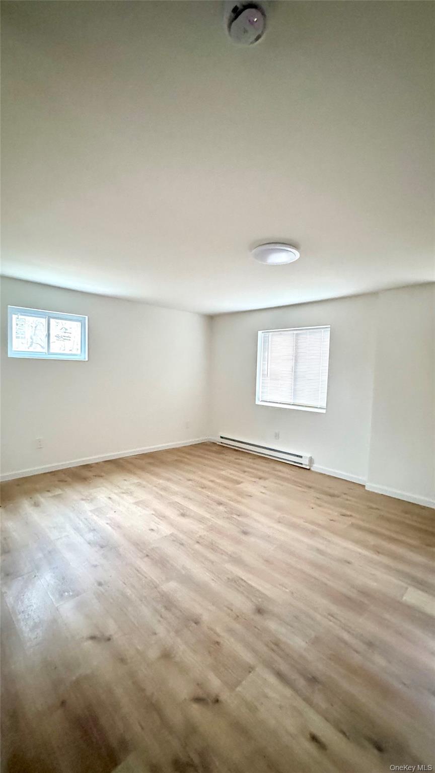 61 Gould Road Centereach, NY 11720 - Photo 18 of 22 an empty room with a workbench