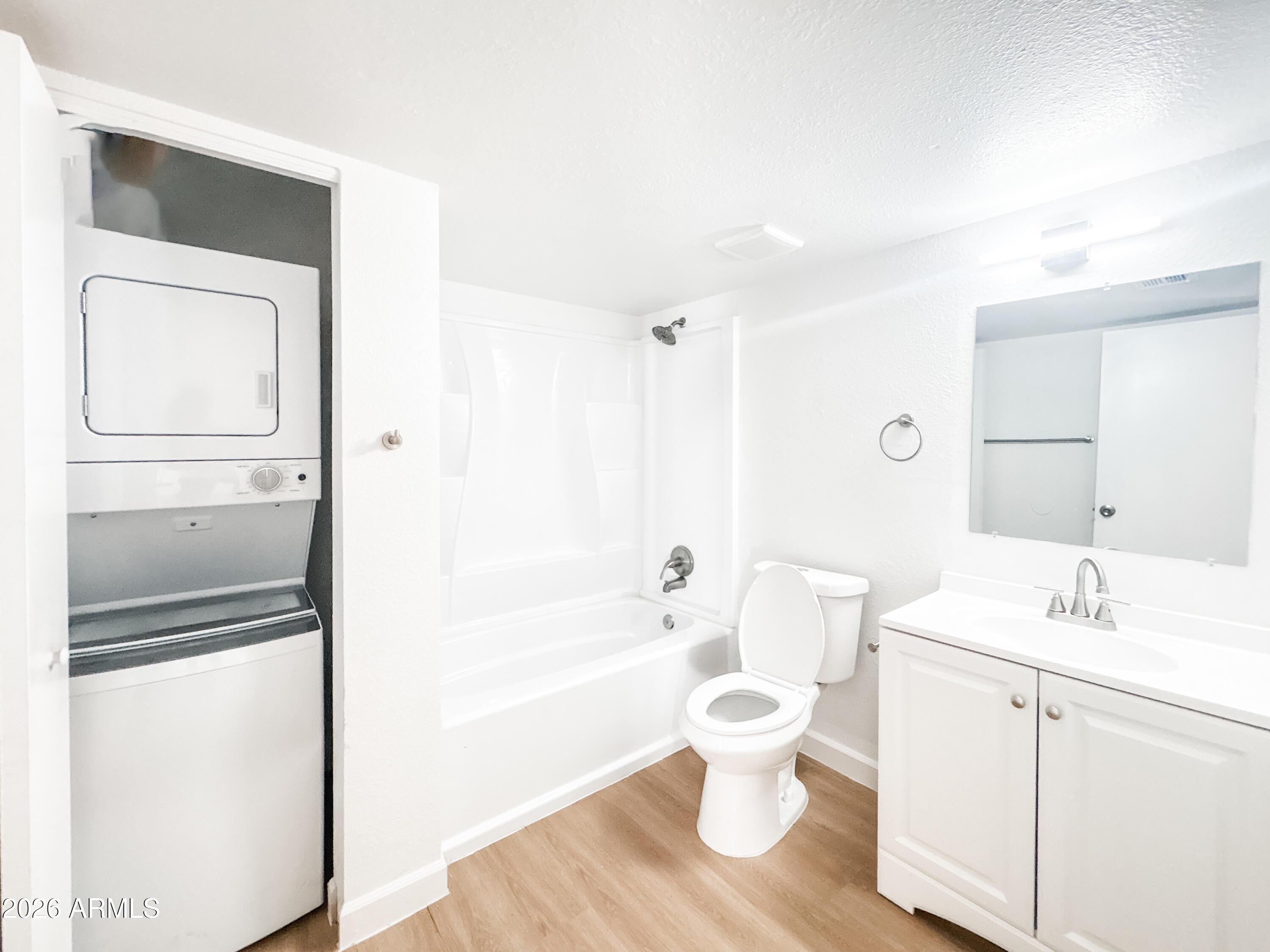 2615 East Greenway Road, Unit 21 Phoenix, AZ 85032 - Photo 15 of 19 a bathroom with a bathtub shower sink and toilet