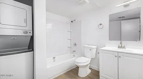a white toilet sitting next to a bathroom sink