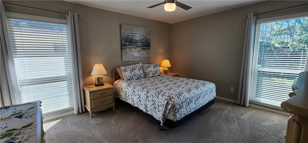 75 Georgetown Boulevard, Unit 75 Naples, FL 34112 - Photo 12 of 28 Carpeted bedroom with ceiling fan