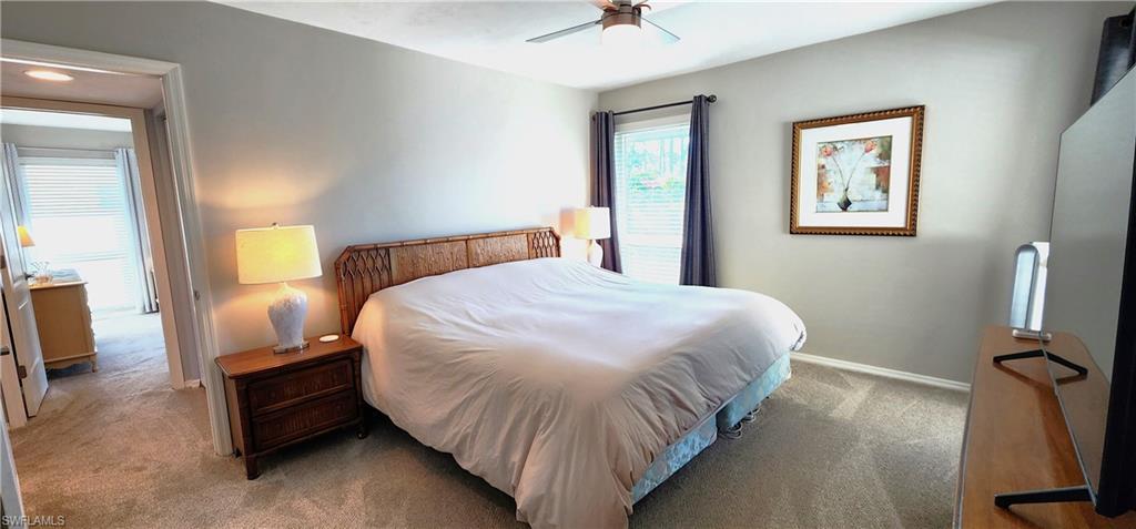 75 Georgetown Boulevard, Unit 75 Naples, FL 34112 - Photo 16 of 28 Bedroom with carpet flooring and ceiling fan
