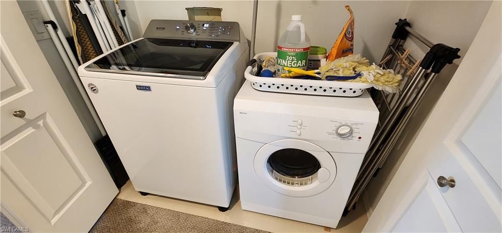 75 Georgetown Boulevard, Unit 75 Naples, FL 34112 - Photo 20 of 28 Clothes washing area with independent washer and dryer