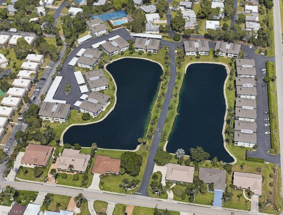 75 Georgetown Boulevard, Unit 75 Naples, FL 34112 - Photo 27 of 28 Drone / aerial view featuring a water view