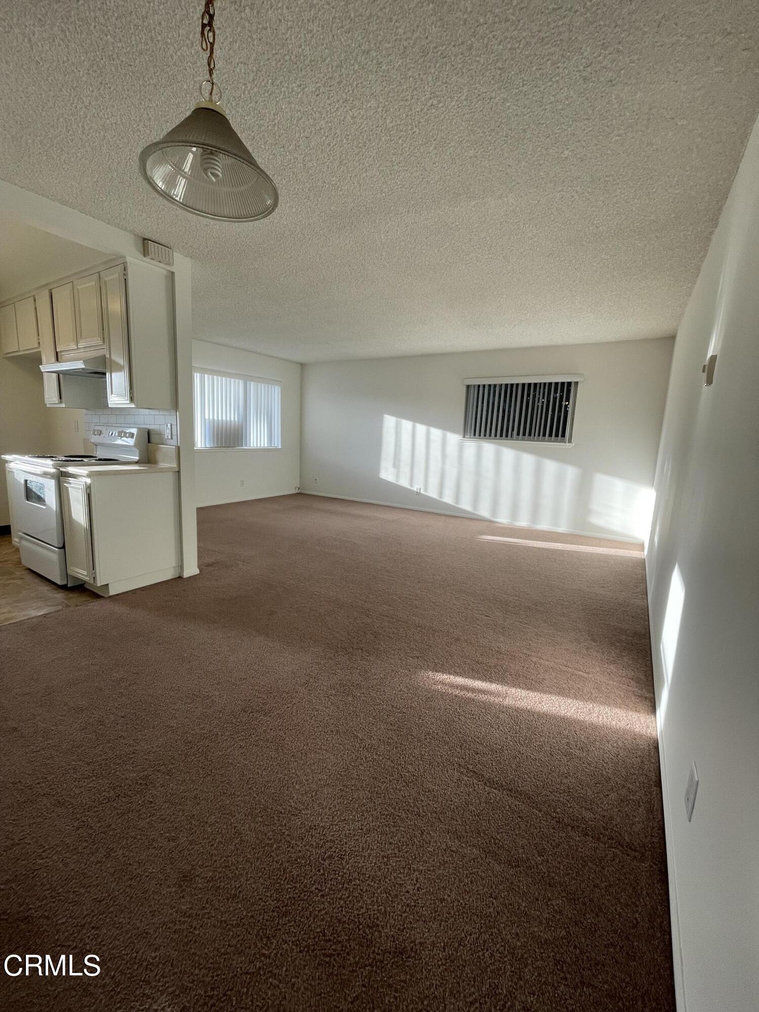 1103 Bryce Way Ventura, CA 93003 - Photo 2 of 8 a view of empty room with wooden floor
