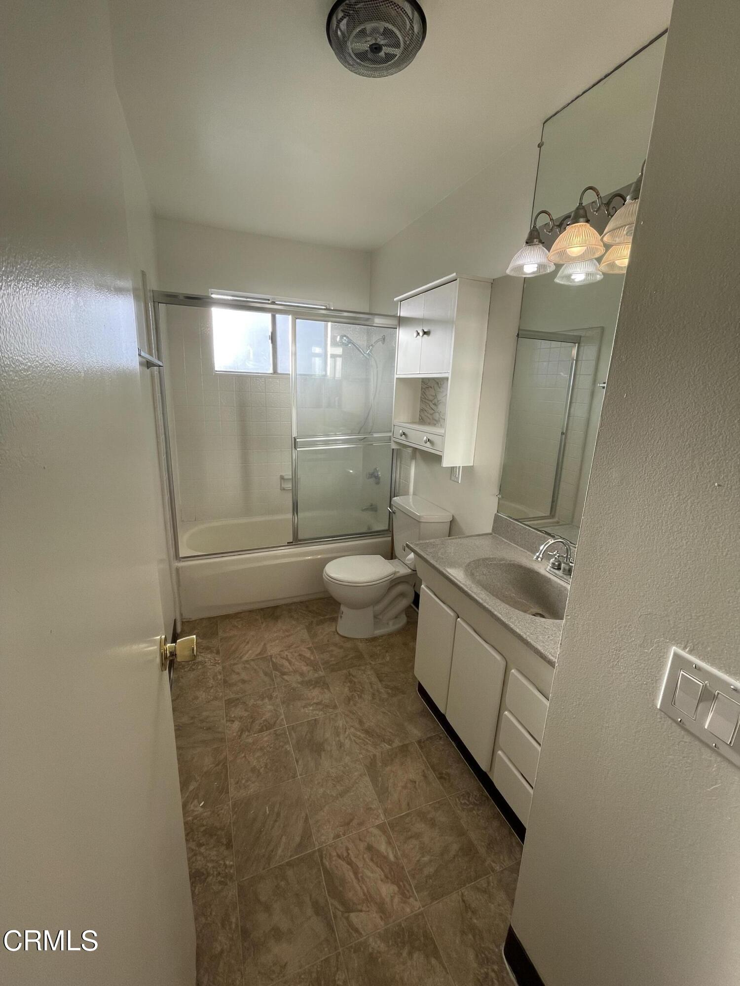 1103 Bryce Way Ventura, CA 93003 - Photo 5 of 8 a bathroom with sink mirror and toilet